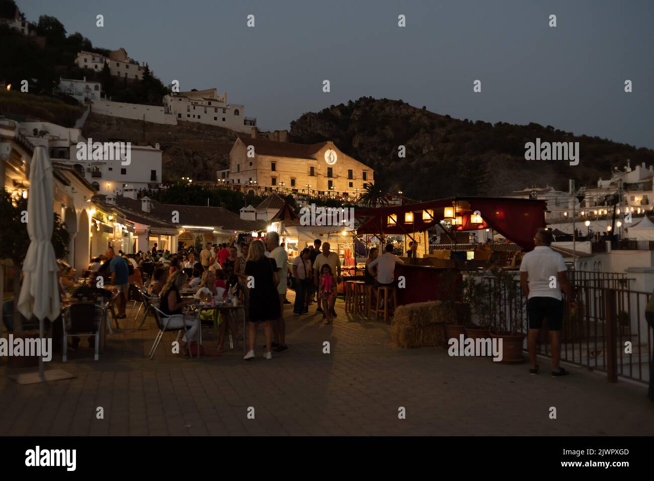 Frigiliana, Malaga, Spain, August 27, 2022: town of Frigiliana in parties with many people celebrating the festival of the three cultures and the El I Stock Photo