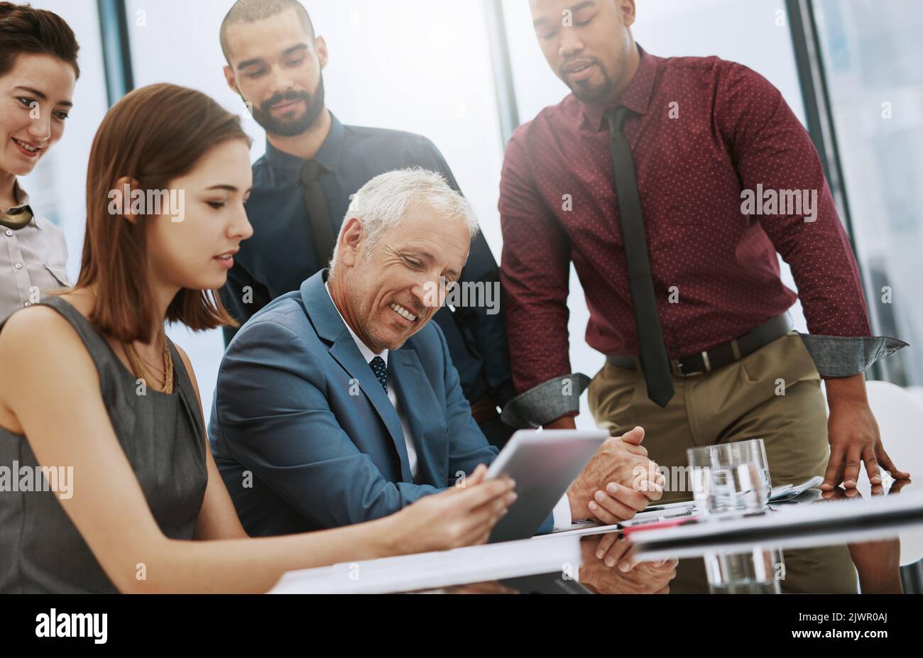 He likes what hes seeing. a group of businesspeople in the boardroom. Stock Photo
