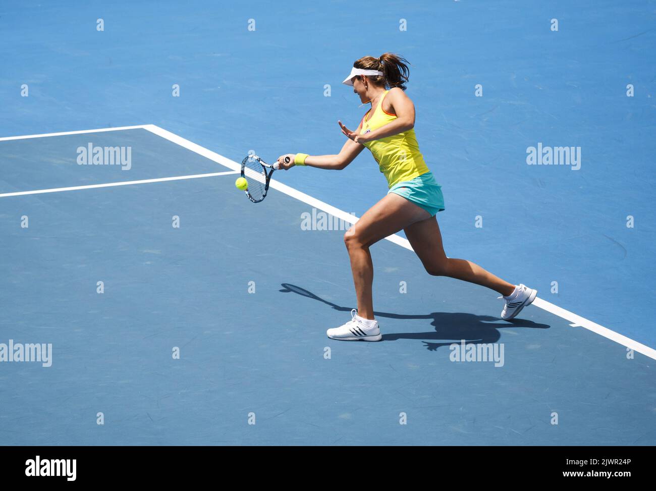 Garbine Muguruza of Spain sets up to return to Mandy Minella of Luxembourg  and Timea Babos of Hungary during the Women's doubles final at the Hobart  Tennis International at the Domain Tennis