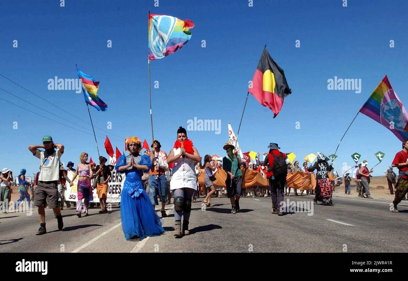 PA PHOTOS/AAP - UK USE ONLY : Two protesters pray for the detainees in ...