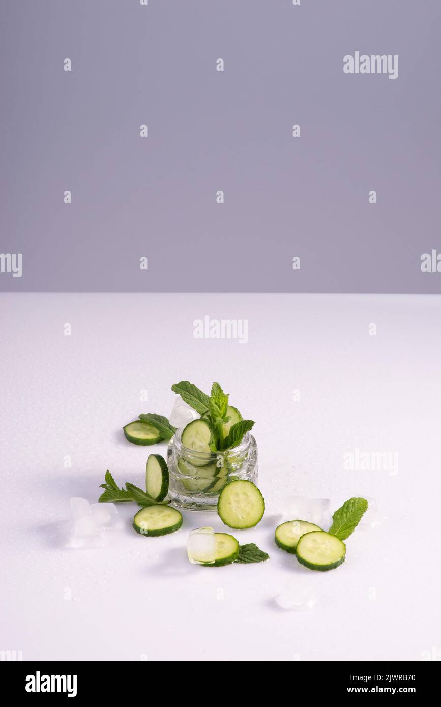 moisturizing cosmetics based on natural extracts of aloe, cucumber and ice in a glass container on a white background. Stock Photo