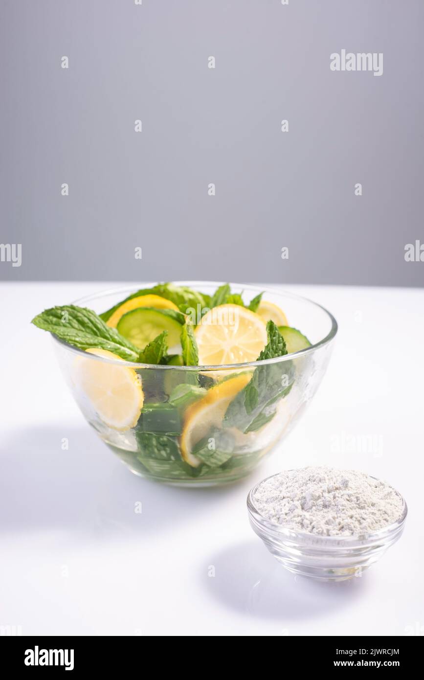 refreshing cosmetic skin care salad in glass plate natural ingredients on white background. Stock Photo