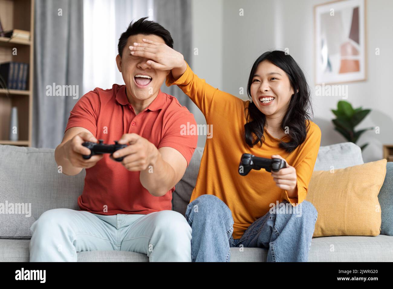 Boyfriend and girlfriend playing video games together Stock Photos - Page 1  : Masterfile