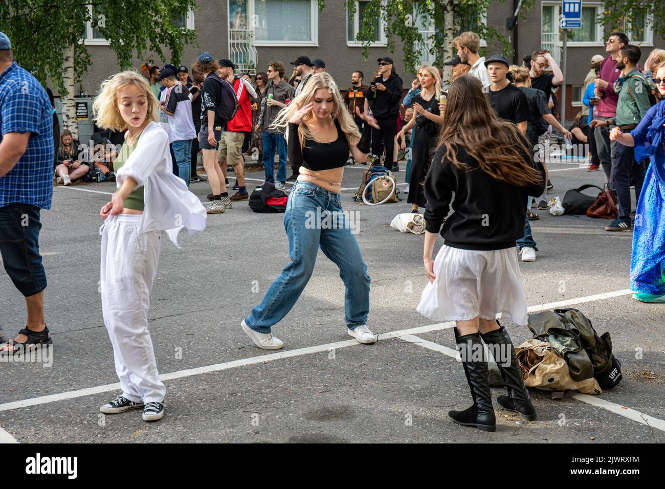 Young women or teenage girls dancing in the street at Kallio Block Party 2022 in Alppila district of Helsinki, Finland Stock Photo