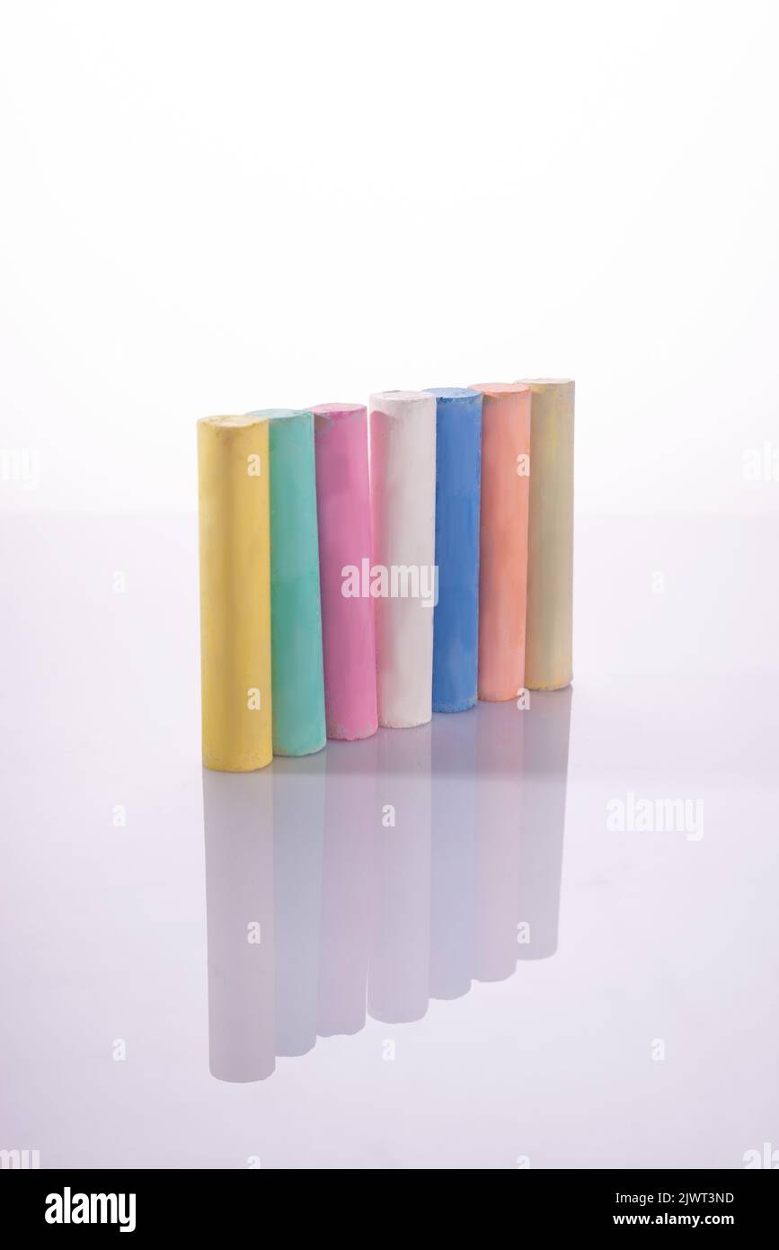 multi-colored cylindrical pastel chalk on a white background Stock Photo
