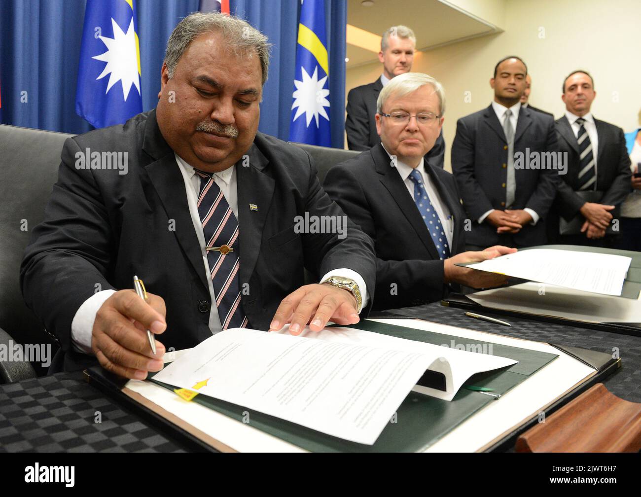 Kevin Rudd Signing President Naru of PNG and Kevin Rudd signing an agreement to take ...