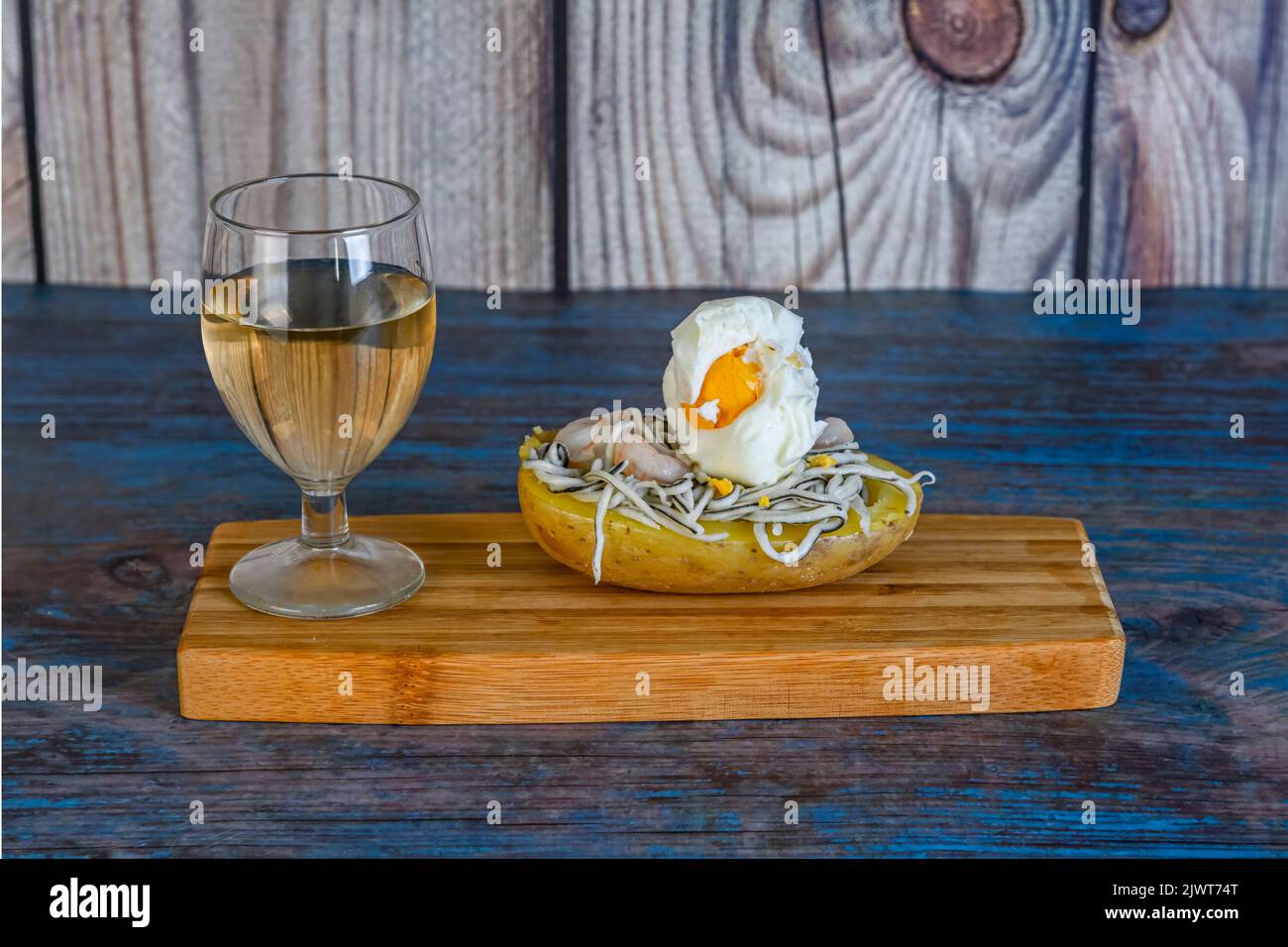 Cooked potato with eels and hardboiled egg Stock Photo Alamy