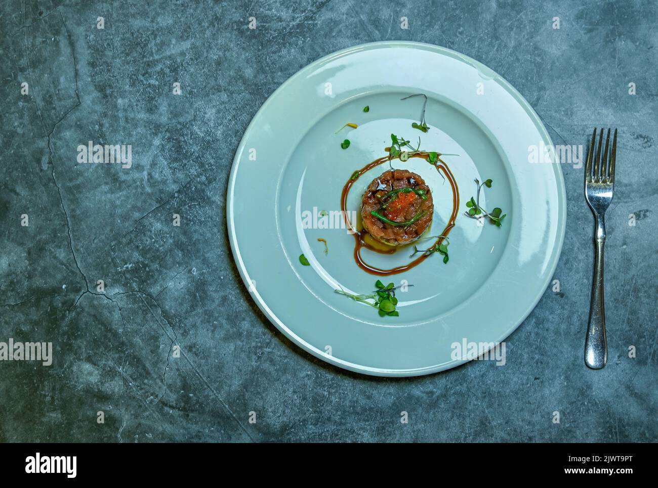 Almadraba red tuna tartare, served on a plate Stock Photo