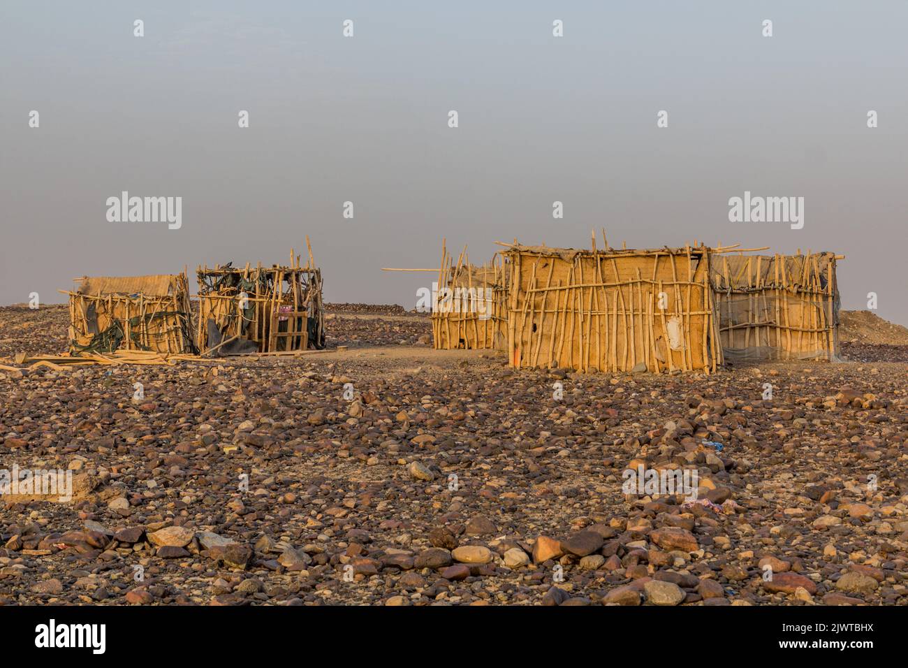 Simple huts in Hamed Ela, Afar tribe settlement in the Danakil depression, Ethiopia. Stock Photo