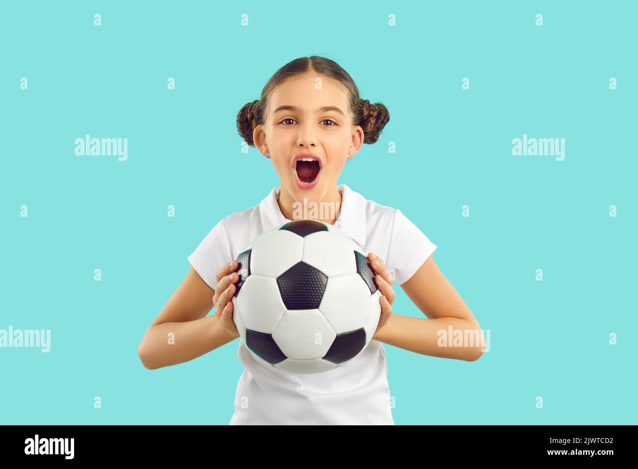 Funny girl with ball support football team Stock Photo