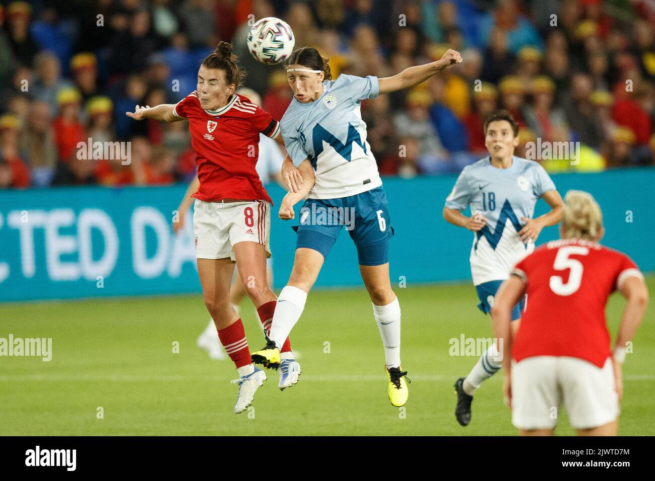 Cardiff, UK. 6th Sep, 2022. Angharad James of Wales and Kaja Korošec of Slovenia go up for a header during the Wales v Slovenia Women's World Cup Qualification match. Credit: Gruffydd Thomas/Alamy Live News Stock Photo