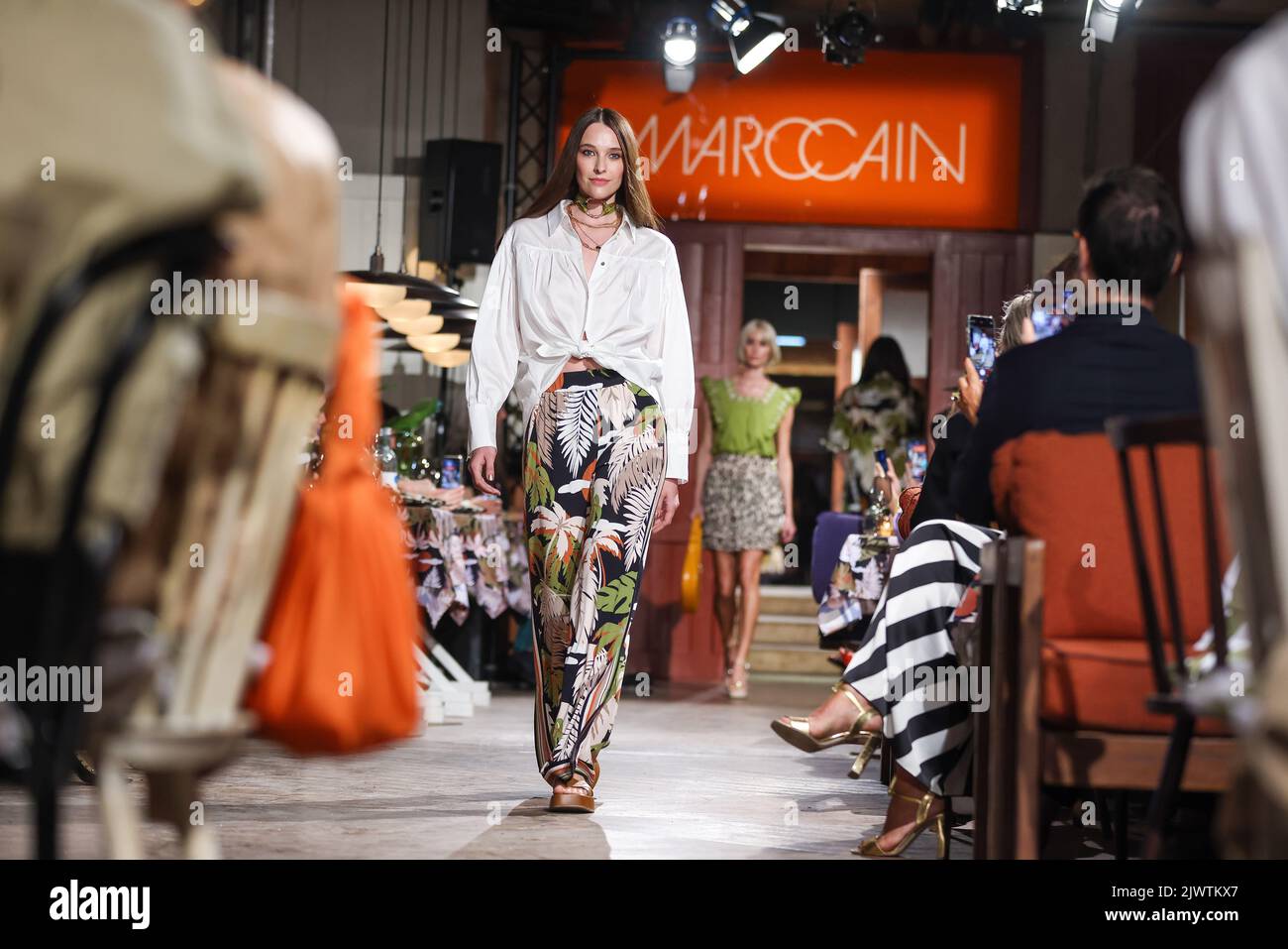 Berlin, Germany. 06th Sep, 2022. Models show creations of the label Marc Cain at the Mercedes-Benz Fashion Week in the Café am Neuen See on the occasion of the Berlin Fashion Week. The Berlin Fashion Week combines several events under one roof. Credit: Gerald Matzka/dpa/Alamy Live News Stock Photo