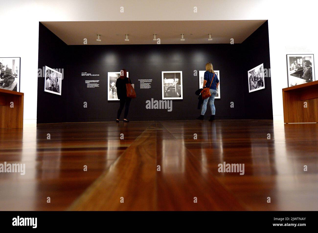 Visitors tour the National Portrait gallery exhibition Elvis at 21 in