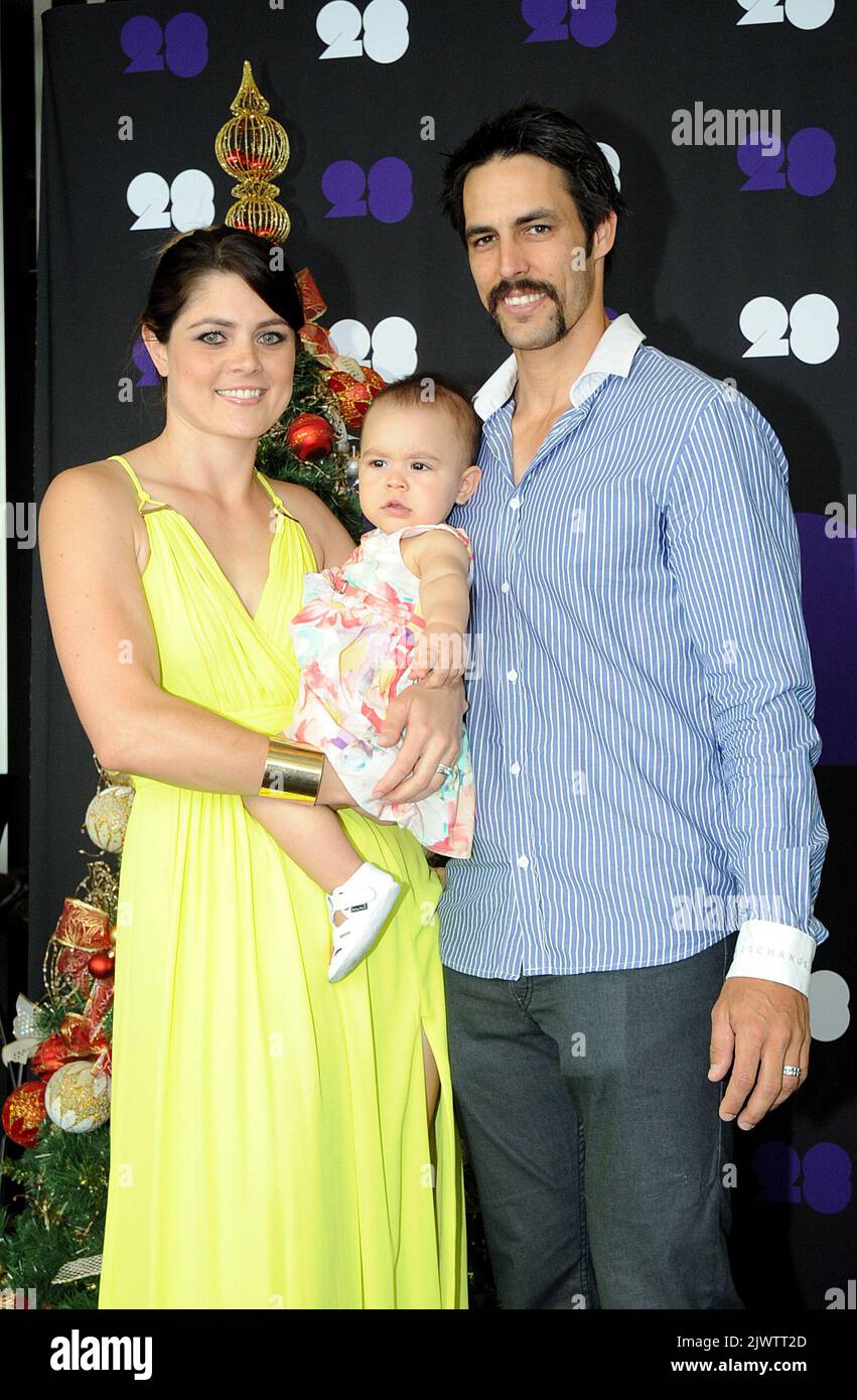 Australian cricket bowler Mitchell Johnson poses with his wife Jessica Bratich-Johnson, and daughter Rubika, at the Cricket Australia Christmas Day Lunch at Crown Metropol, Wednesday 25 Dec.2013. England will take on Australia in the fourth Ashes series test, starting on Boxing Day at the MCG. (AAP Image/Joe Castro) NO ARCHIVING ** STRICTLY EDITORIAL USE ONLY, NO COMMERCIAL USE, NO BOOKS ** Stock Photo