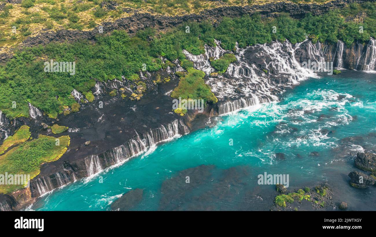 Icelandic amazing Hraunfossar Waterfalls and lazure blue water Stock