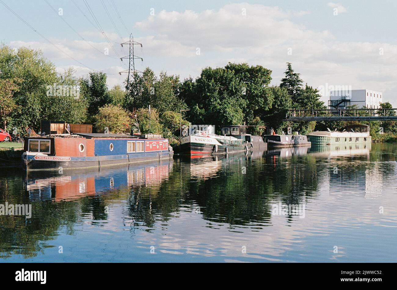 Narrowboats on the River Lea at Tottenham Marshes, North London UK, in late summer Stock Photo