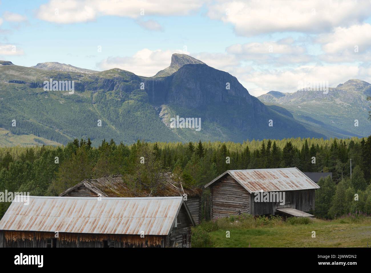 Old farm in Hemsedal, Norway with part of the Hemsedal mountains in the