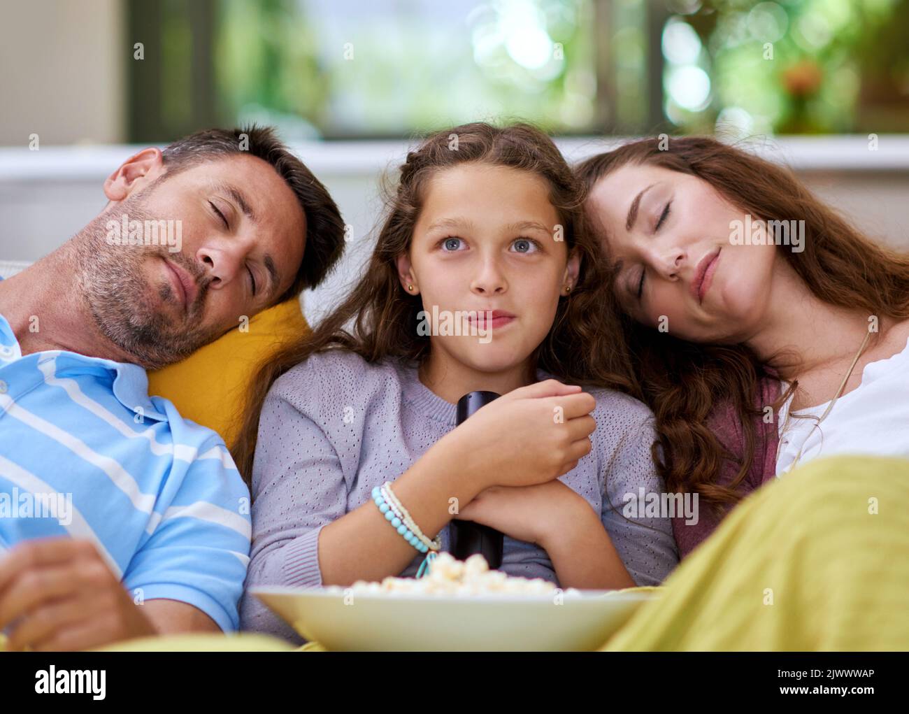Her parents couldnt last the distance. a young girl watching a movie