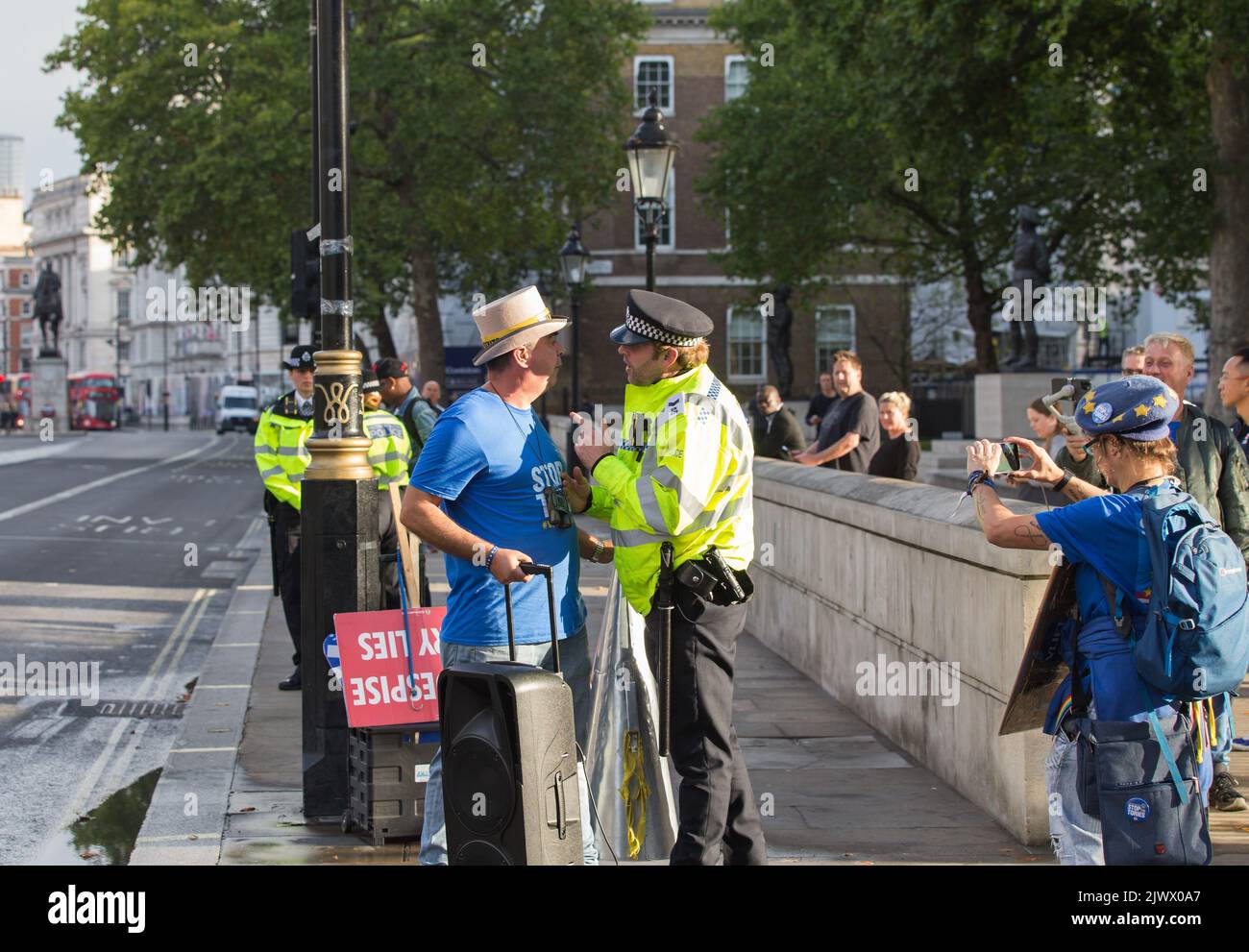 London UK 6th September Steve Bray outside Downing street playing music as Boris johnson gives his last speech and police officer points finger at him Stock Photo