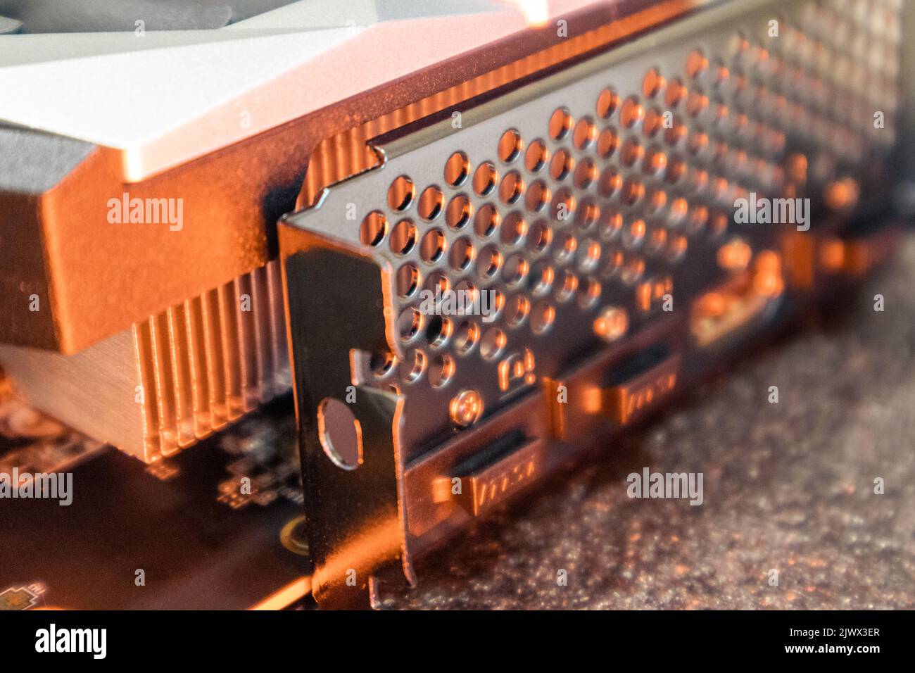 Kyiv, Ukraine - August 19, 2022: MSI graphics card ports panel, PC hardware details in orange light. Components from powerful modern personal computer Stock Photo