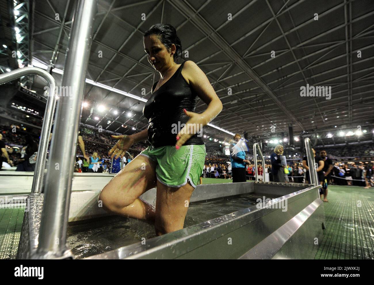 Jehovahs Witness sisters are baptised during the International