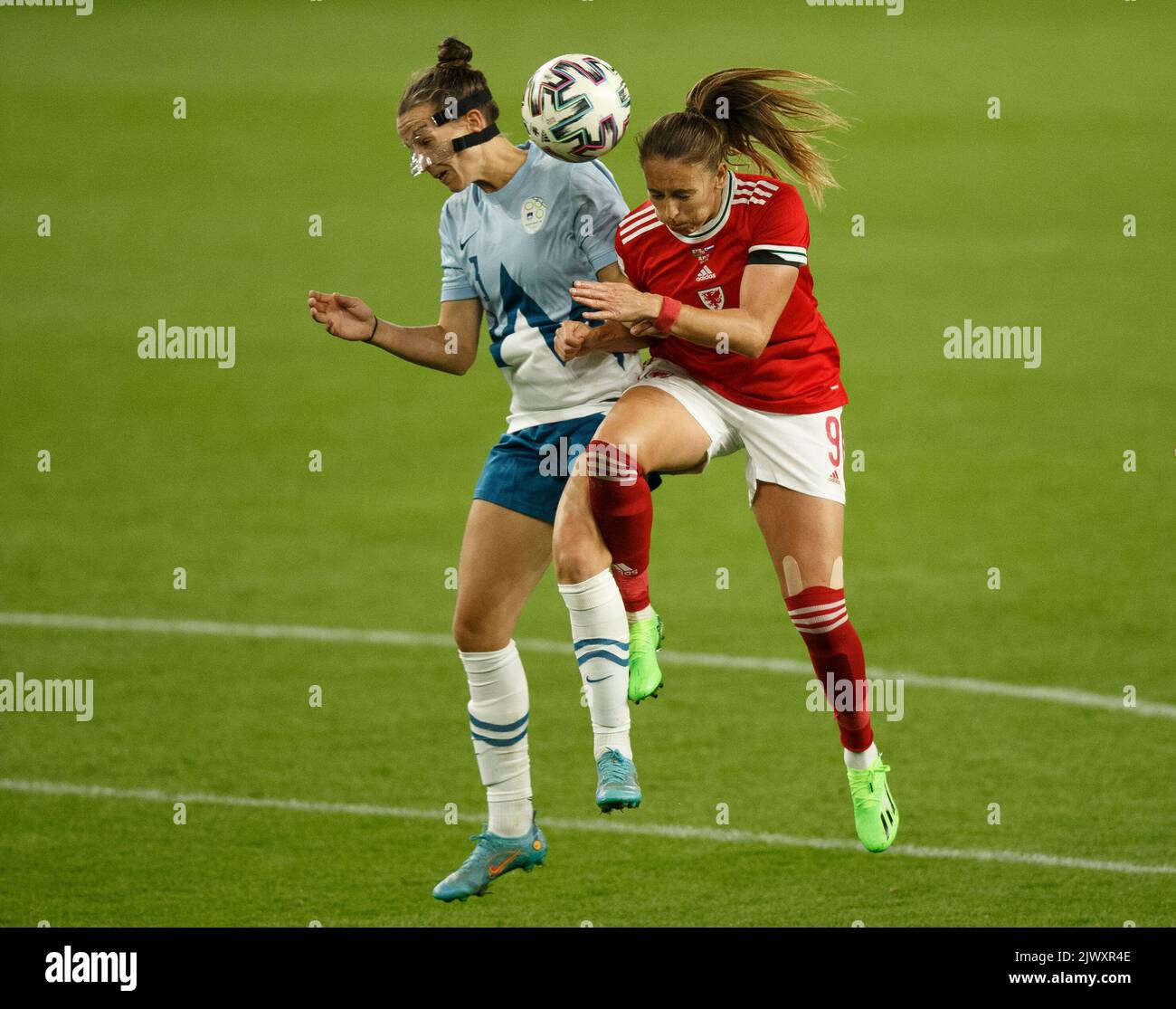 Cardiff, UK. 6th Sep, 2022. Kayleigh Green of Wales and Sara Agrež of Slovenia head the ball during the Wales v Slovenia Women's World Cup Qualification match. Credit: Gruffydd Thomas/Alamy Live News Stock Photo