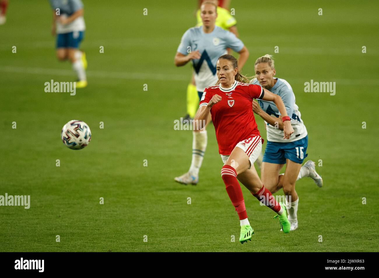 Cardiff, UK. 6th Sep, 2022. Kayleigh Green of Wales chases after the ball, chased by Kaja Eržen of Slovenia during the Wales v Slovenia Women's World Cup Qualification match. Credit: Gruffydd Thomas/Alamy Live News Stock Photo