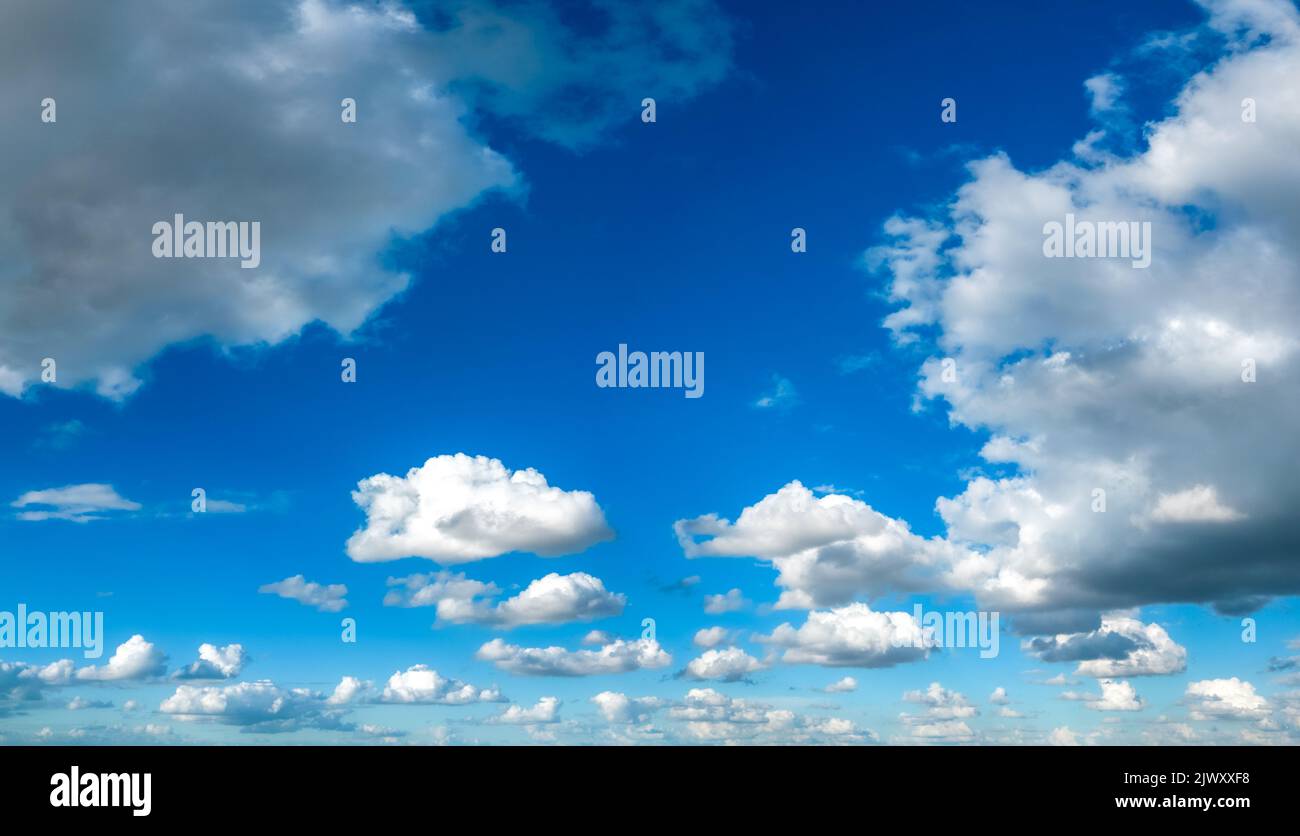 Cumulus Clouds on Blue Sky Background Stock Photo