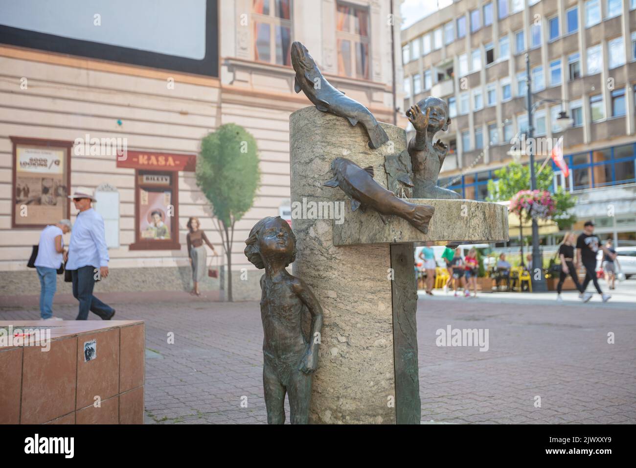 Lodz, Poland - August 7, 2022: Children and fish fountain in Łódź, Poland Stock Photo