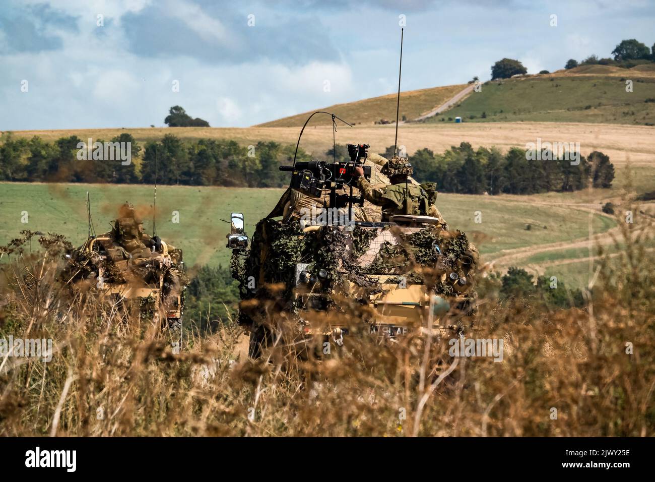 british army Supacat Jackal 4x4 rapid assault, fire support and reconnaissance vehicle in action on a military exercise Stock Photo