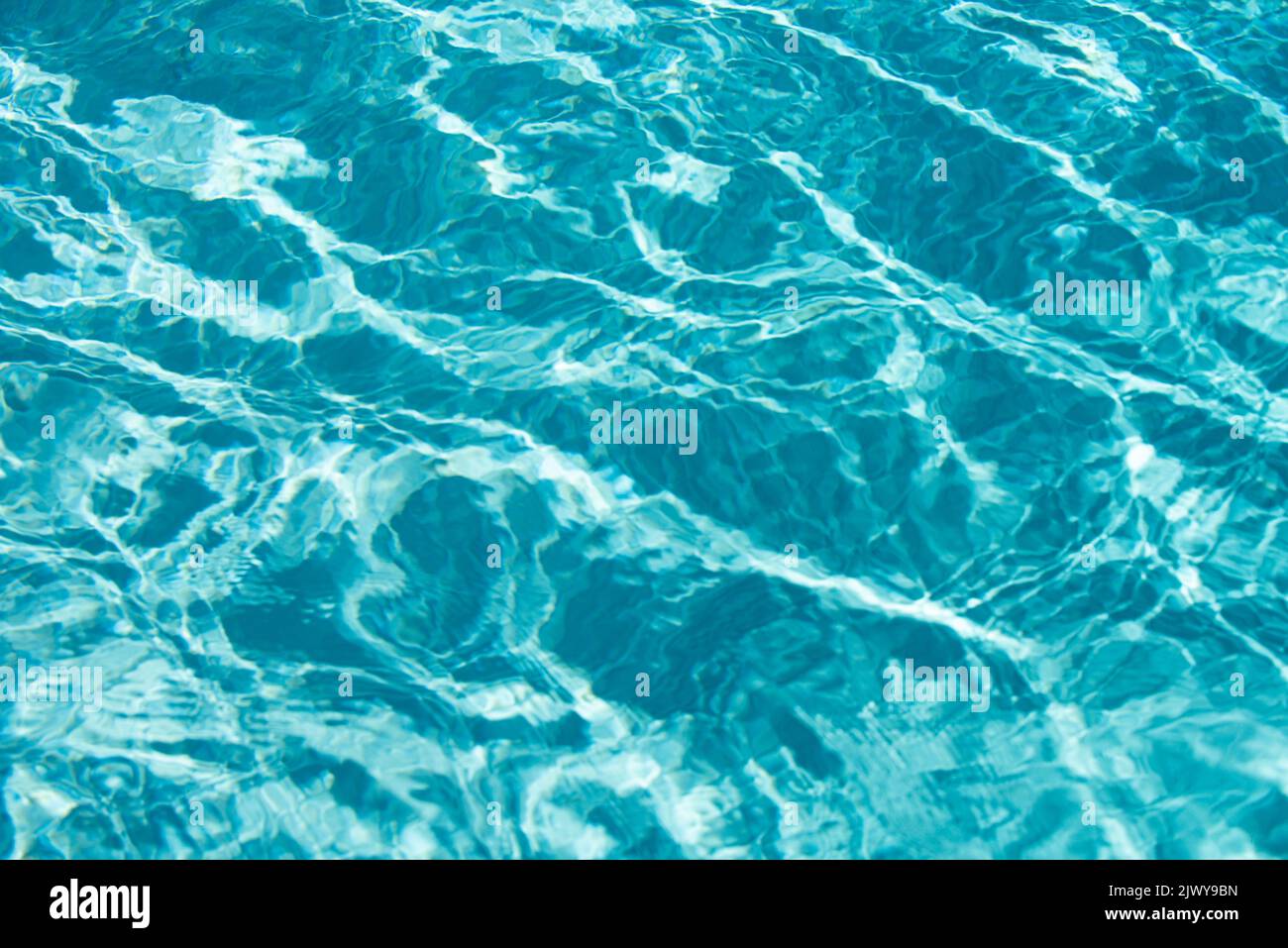 Water in swimming pool, background with high resolution. Wave abstract
