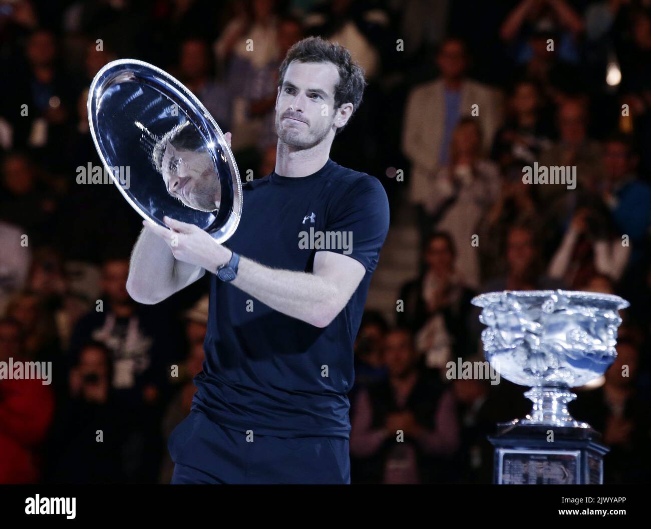Andy Murray of Britain holds his second place plate after losing
