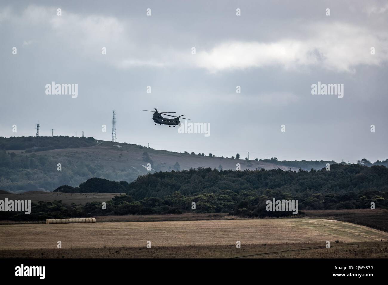 RAF Chinook tandem-rotor CH-47 helicopter flying fast and low in a ...