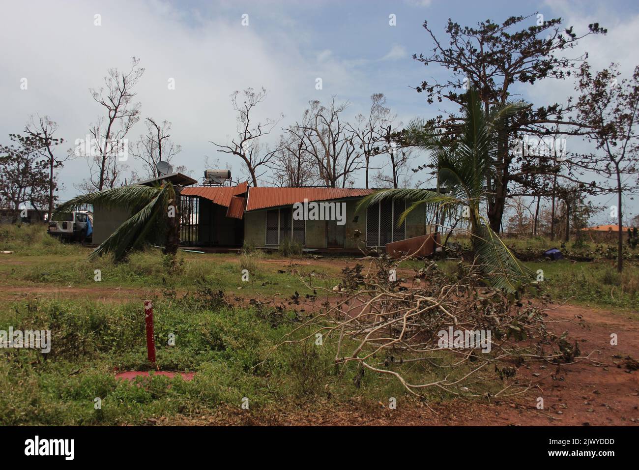 A house damaged by fallen trees courtesy of Tropical Cyclone Lam in ...