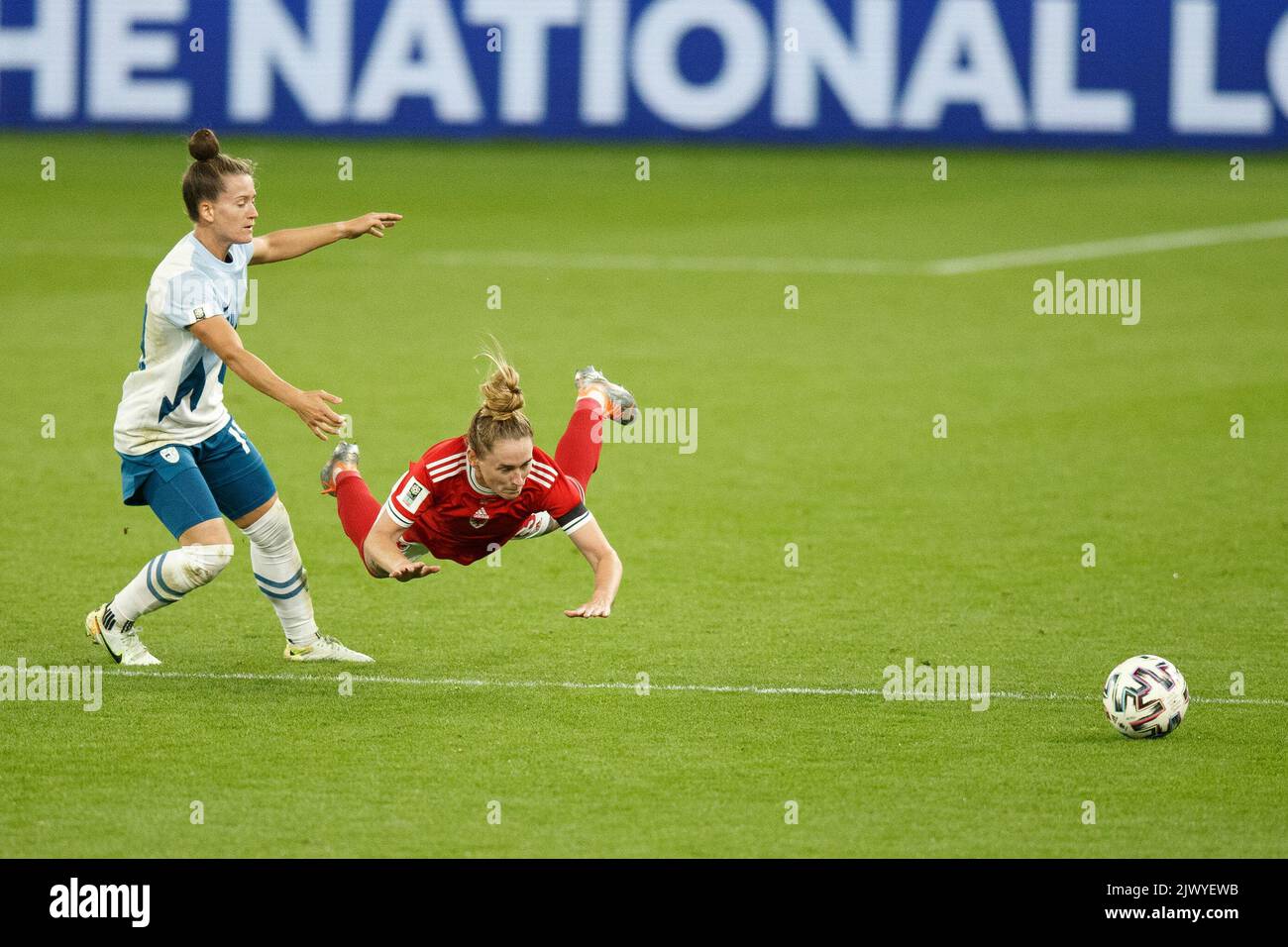 Cardiff, UK. 6th Sep, 2022. Rachel Rowe of Wales is tackled by Špela Kolbl of Slovenia during the Wales v Slovenia Women's World Cup Qualification match. Credit: Gruffydd Thomas/Alamy Live News Stock Photo