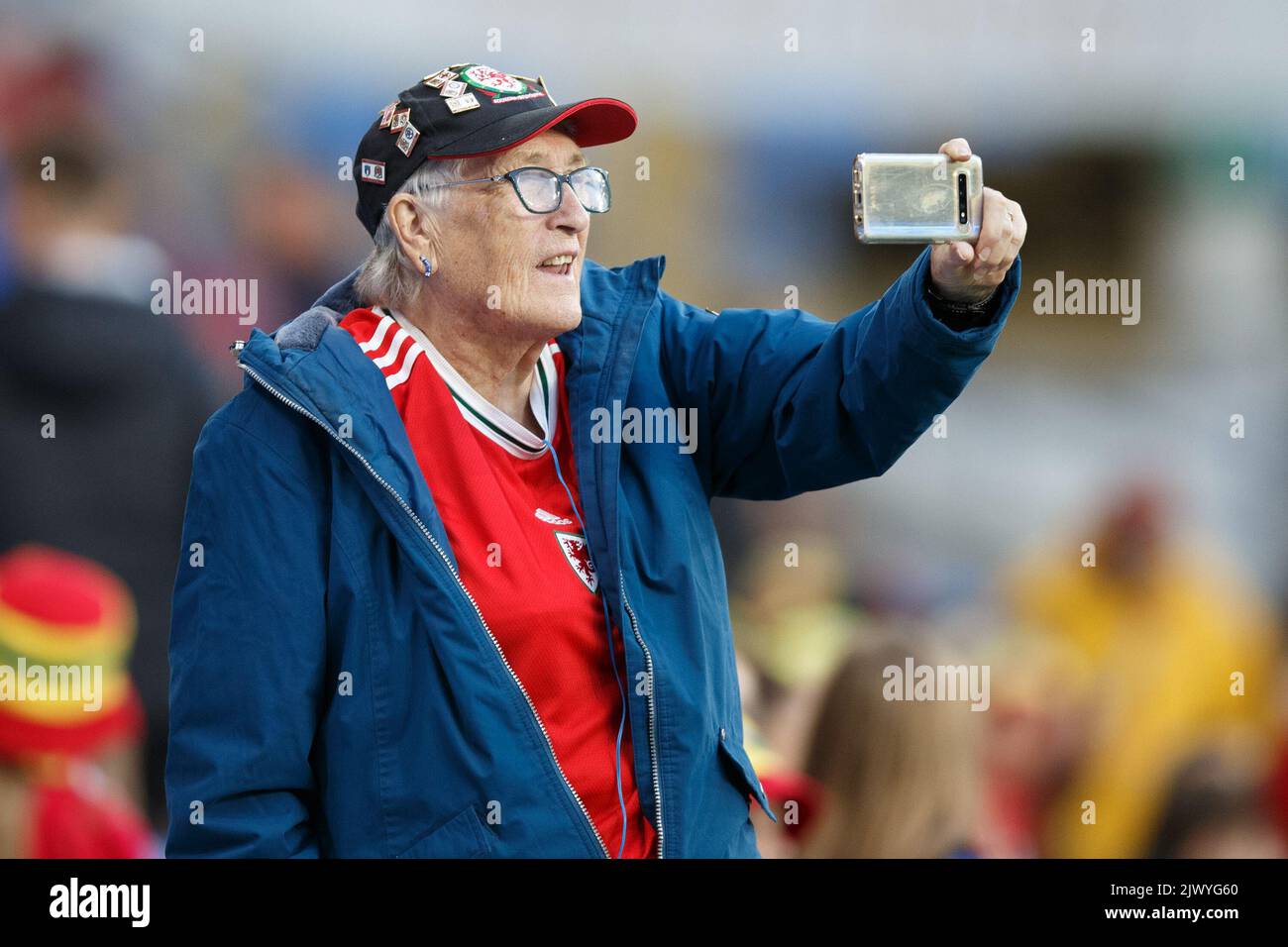 Cardiff, UK. 6th Sep, 2022. A Wales supporter takes a selfie during the Wales v Slovenia Women's World Cup Qualification match. Credit: Gruffydd Thomas/Alamy Live News Stock Photo