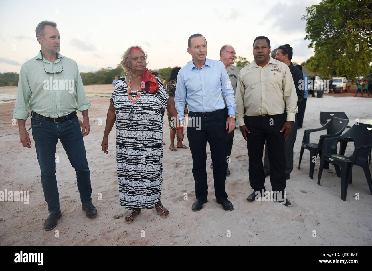 Ameic Injinoo Australian Prime Minister Tony Abbott (second right) hold hands with an ...