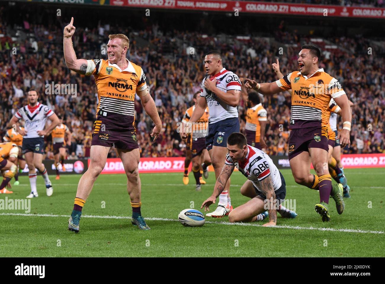 Jack Reed of the Brisbane Broncos (left) celebrates scoring a try ...
