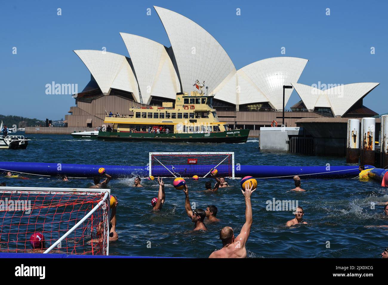 A general view of the Australian and Italian water polo teams warming