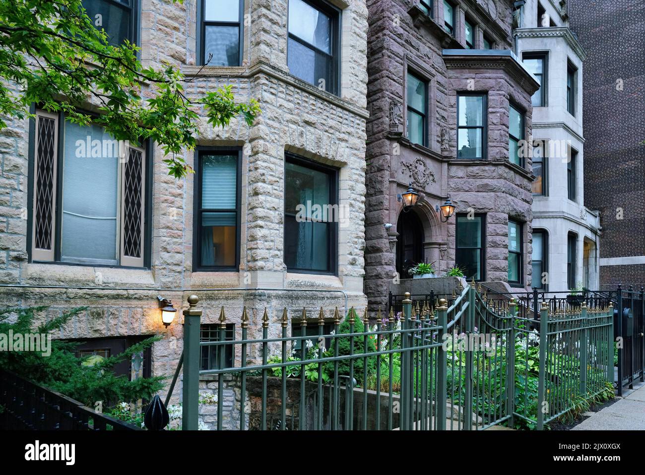 Urban residential street with old brownstone townhouses Stock Photo