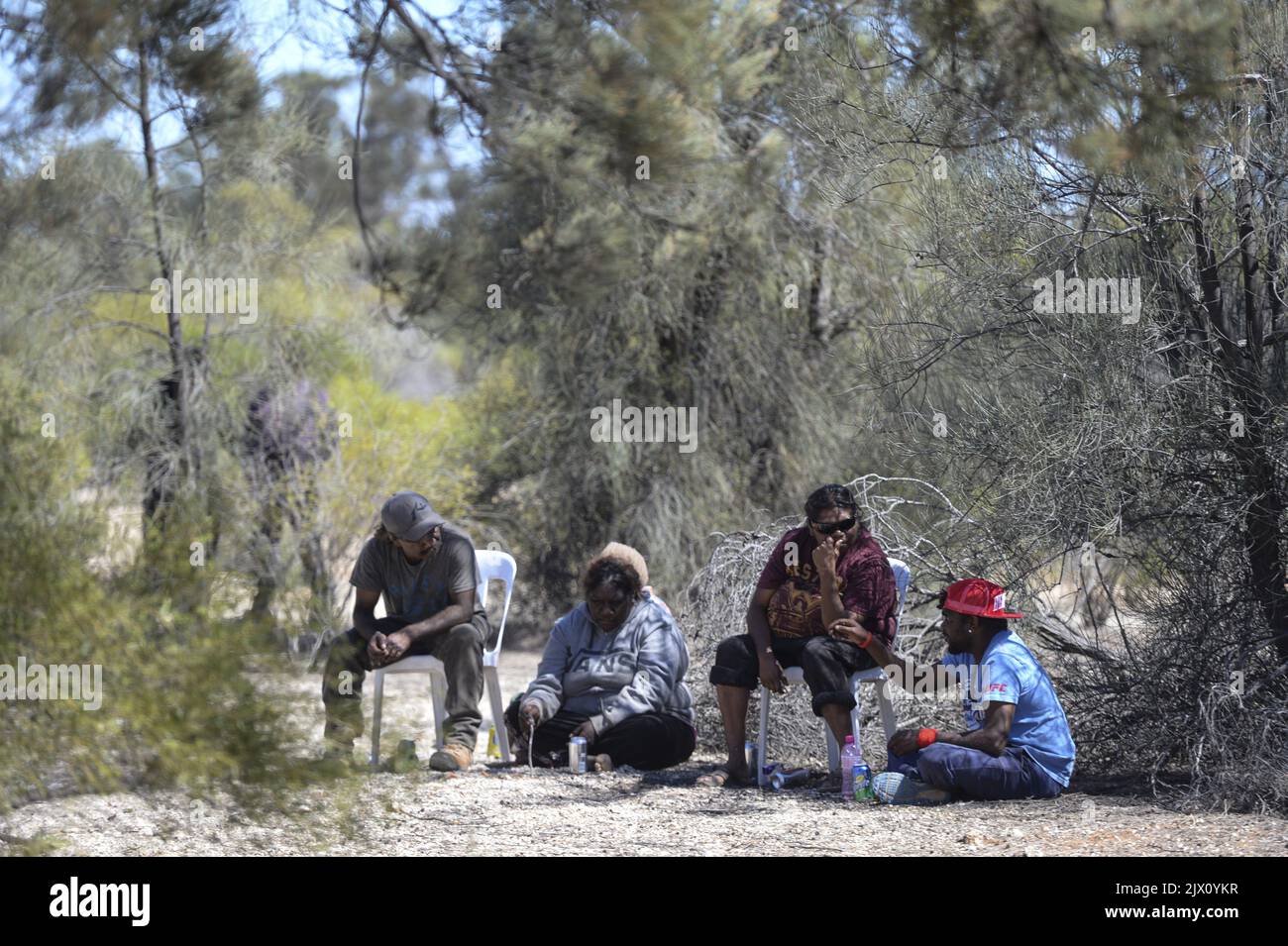 Locals attend a ceremony for the excision of Section 400 from the