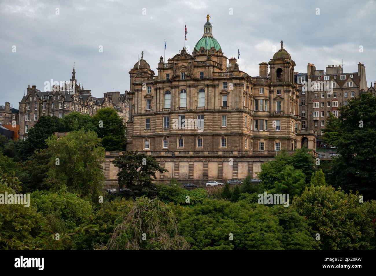 View from Princes street to old town and castle in Edinburgh city, view on houses, hills and trees in old part of the city, Scotland, UK in summer Stock Photo