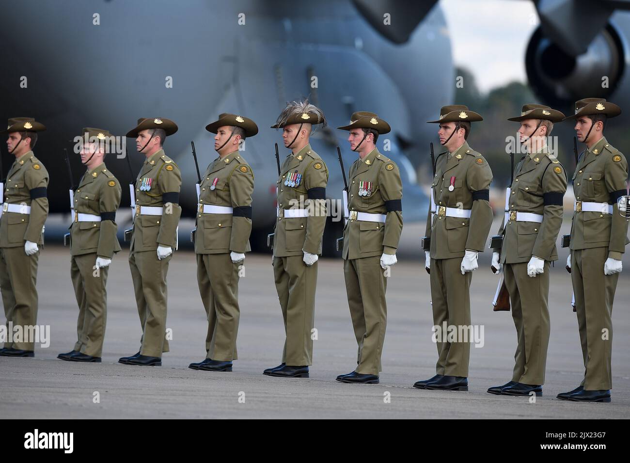 An honour guard made up of Australian Defence Force personnel, stands ...