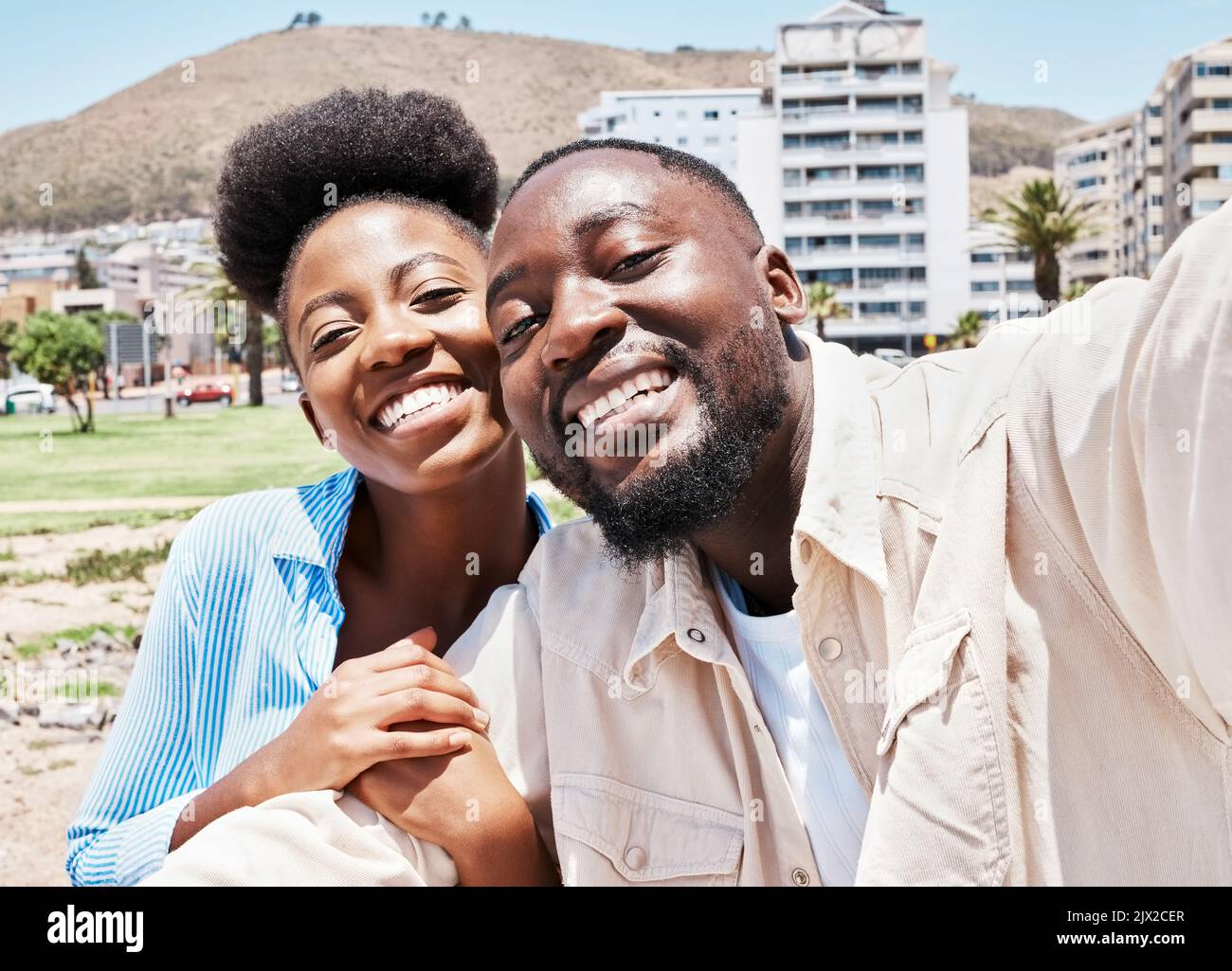 Portrait, love selfie and happy black couple together in the city, street or outdoors. Romance, man and woman taking a romantic picture with happiness Stock Photo