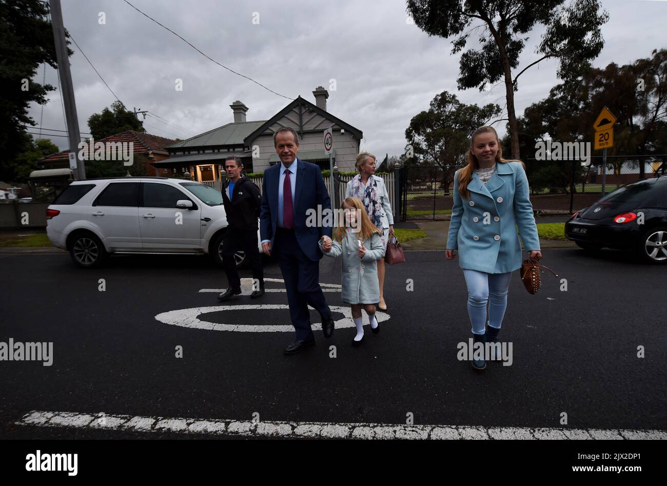 Opposition leader Bill Shorten (back) leaves his home with his wife Chloe (back right), and daughters Clementine (centre) and step daughter Georgette (right) in Melbourne, Monday, July, 4, 2016. (AAP Image/Tracey Nearmy)  Stock Photo