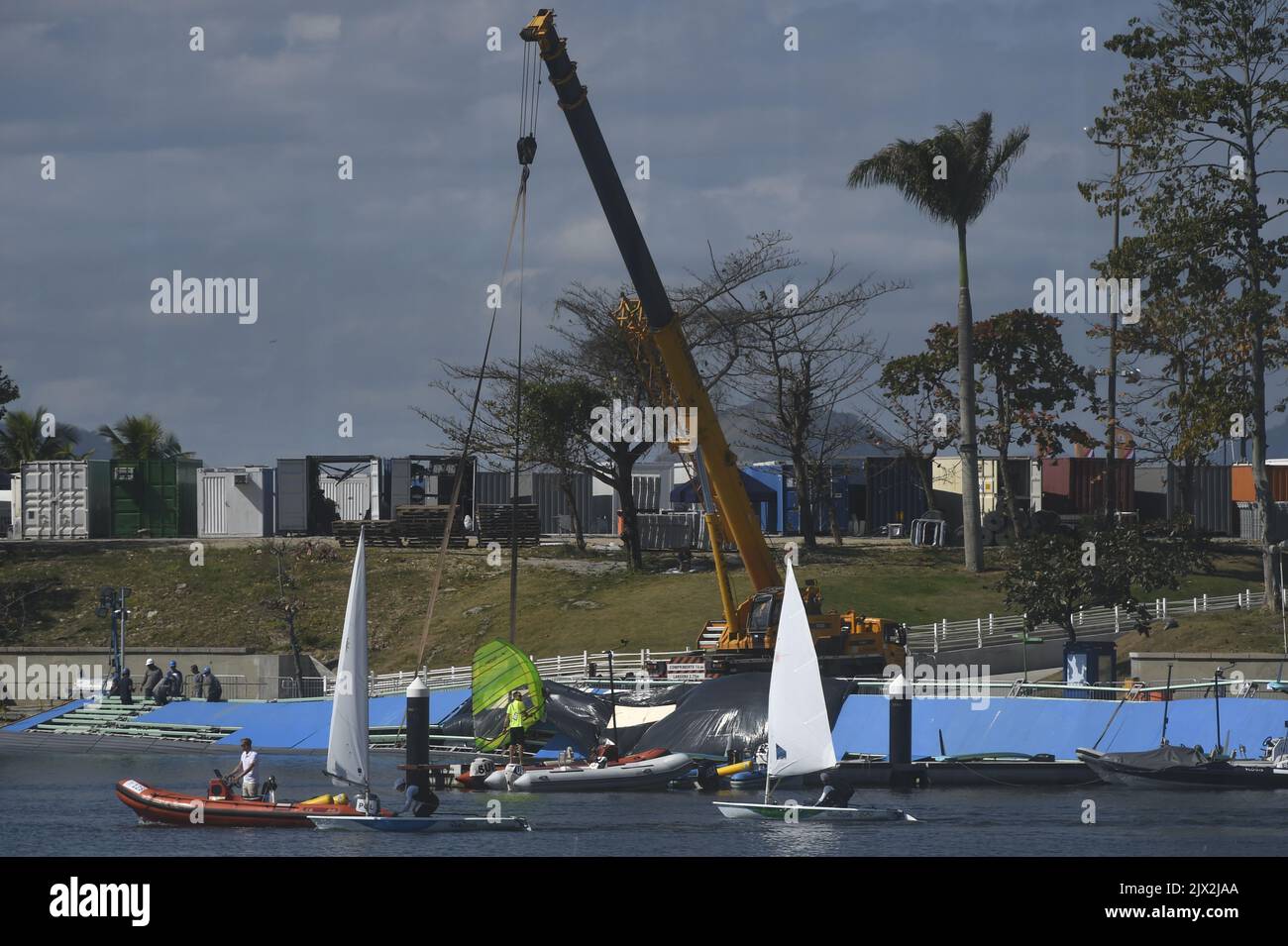 Construction workers are seen repairing a broken boat ramp at the ...
