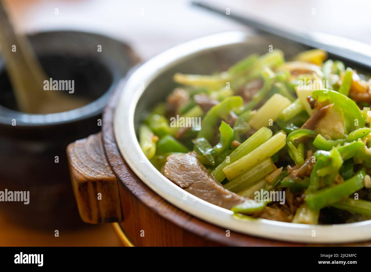 angle view fast food of fried pork and fish with celery with bowl of soup horizontal composition Stock Photo