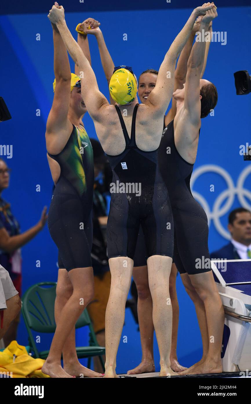 Members of the Womens 4x100 Freestyle Relay celebrate their gold medal ...