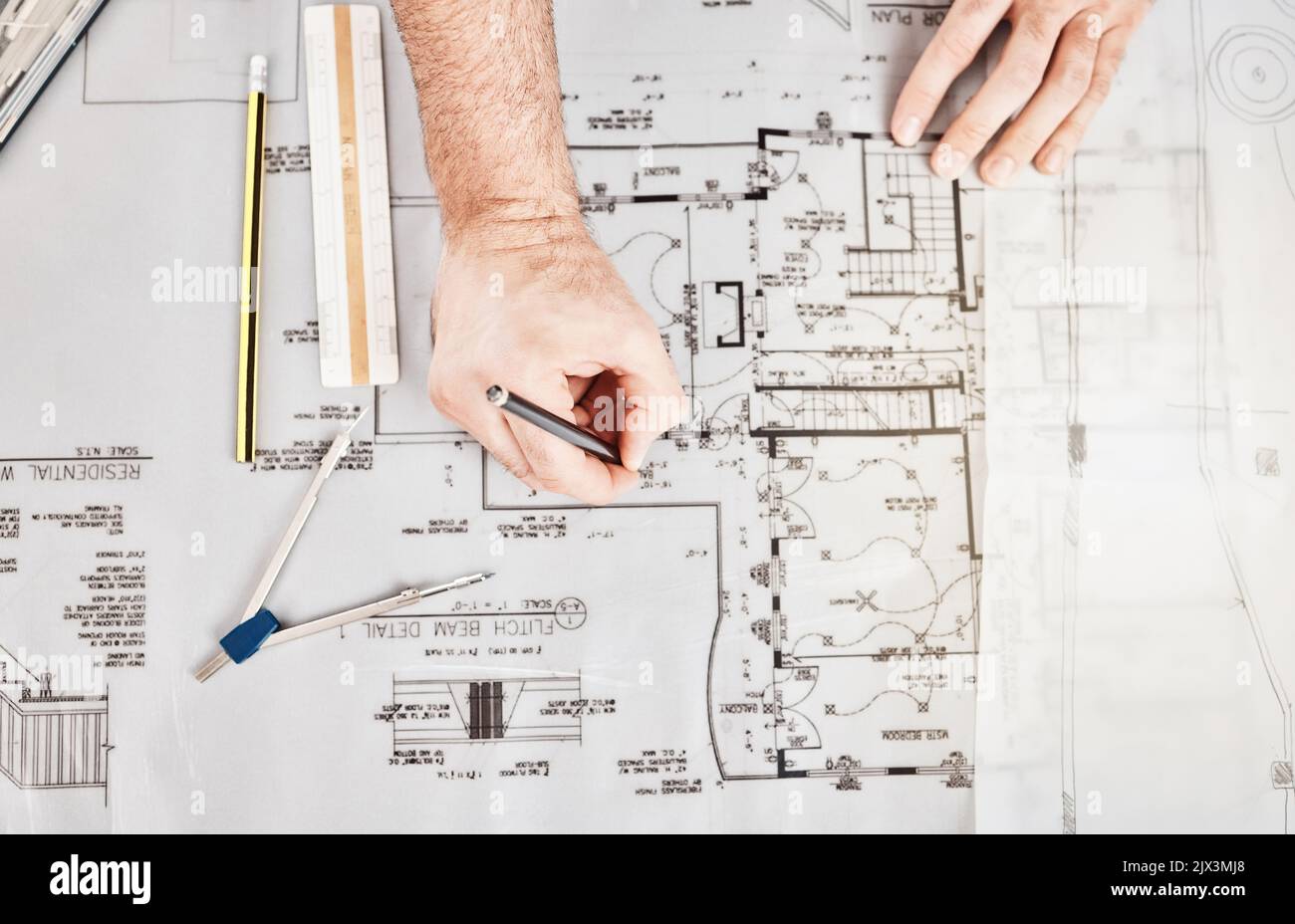 Interior design drawing illustration of building floor plan render, architecture technical blueprint and creative house project. Hands of designer Stock Photo