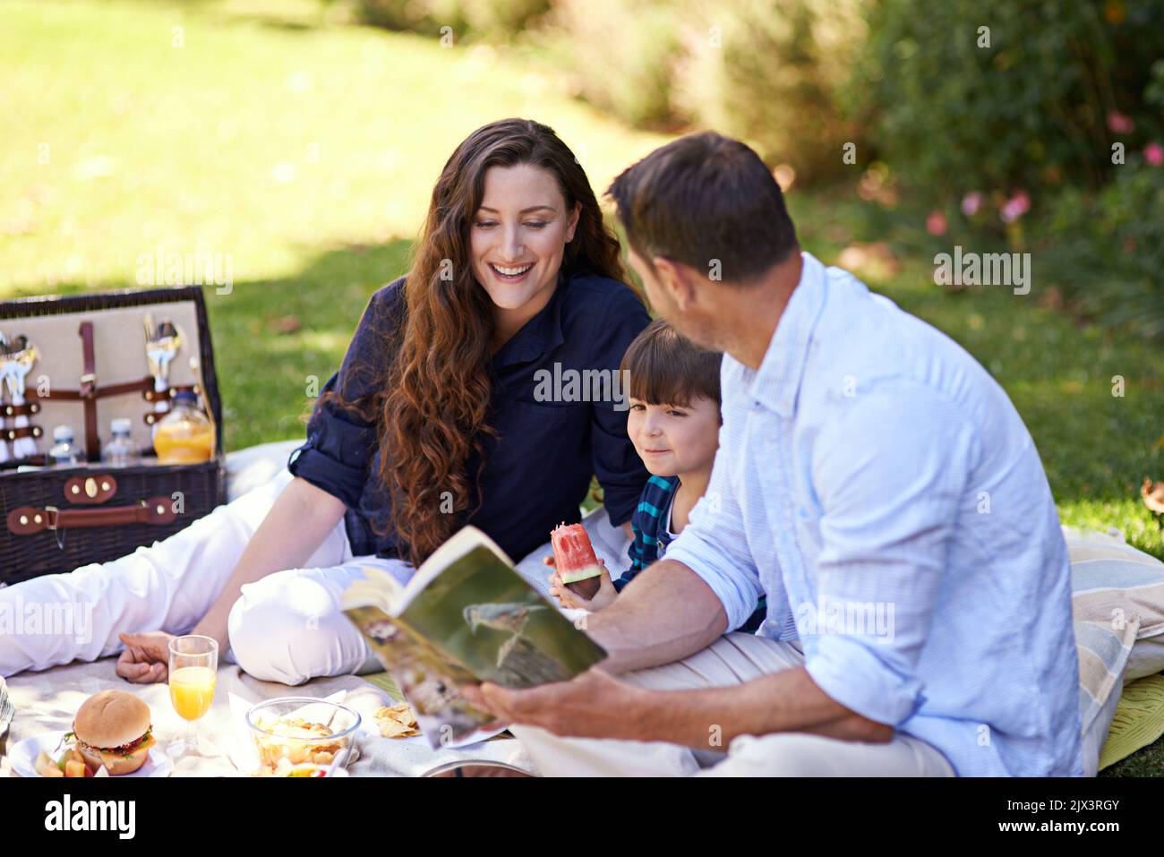 The perfect day for a picnic. a family enjoying a picnic together. Stock Photo